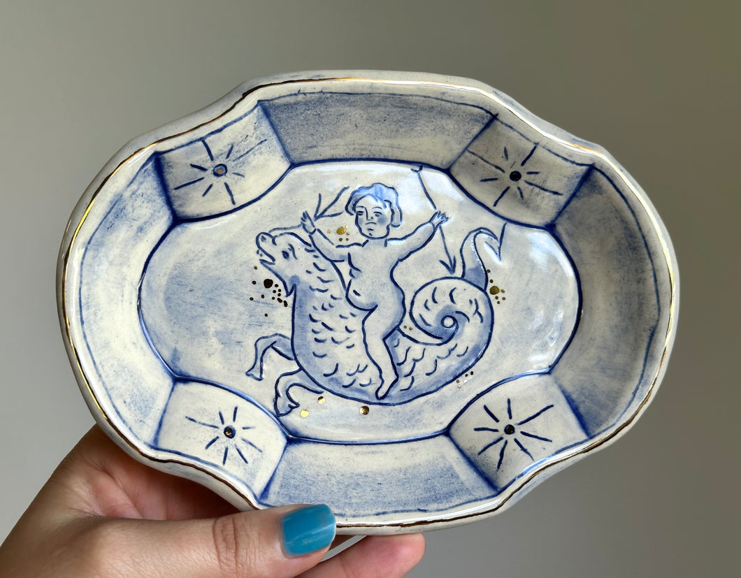 Putti riding sea dragon catchall dish 18