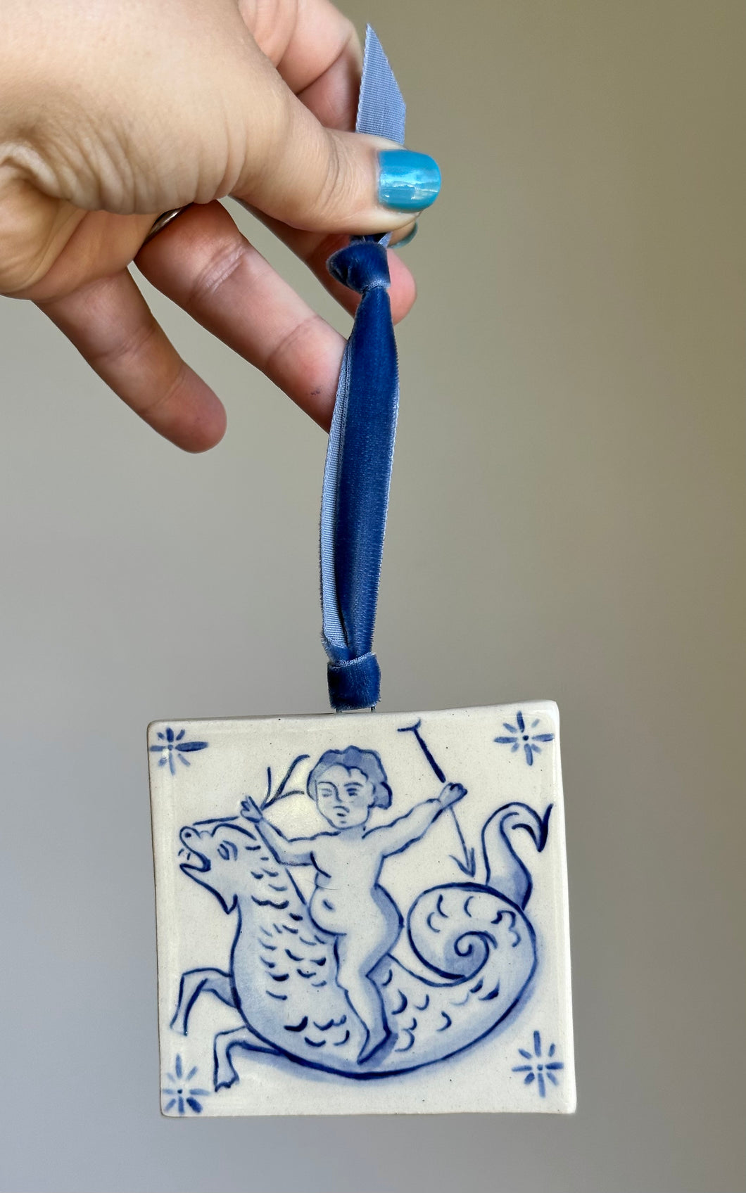 Putti riding sea dragon 11